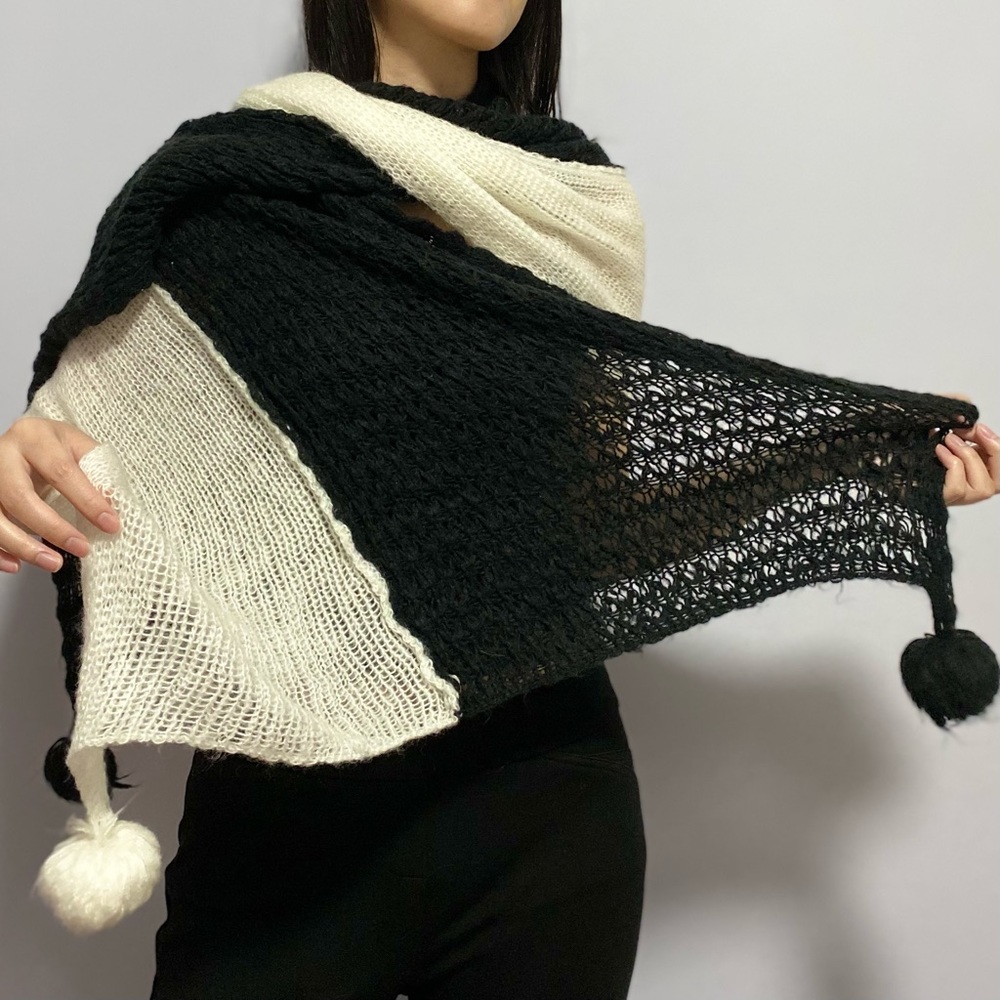 Black and white scarf with pom poms